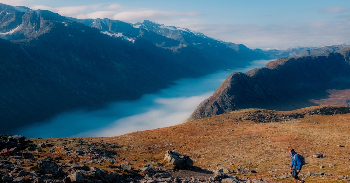 friluftsliv meaning — hiker on Besseggen ridge in Norway with panoramic mountain views