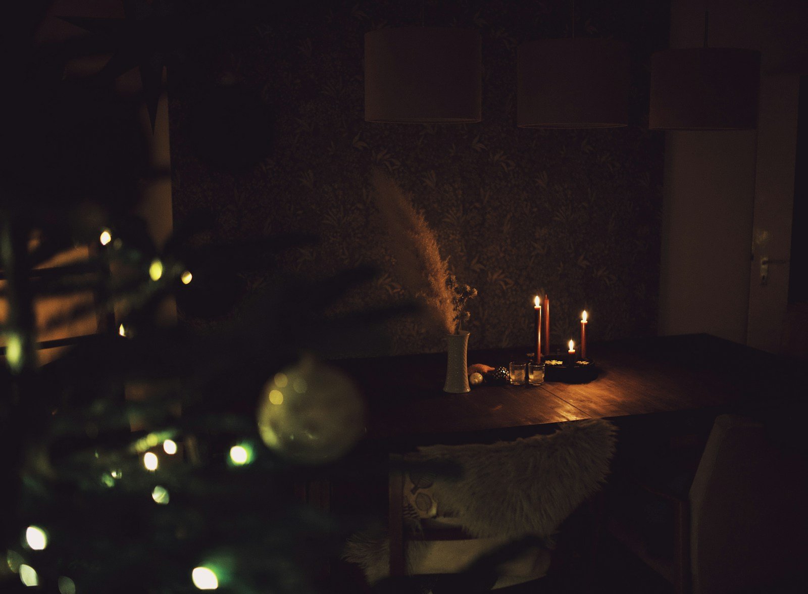 vorfreude meaning — an Advent candle glowing warmly in a dark room, evoking joyful anticipation